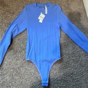 Bodysuit with whole in the back small medium